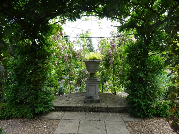 Stone urn with plants.